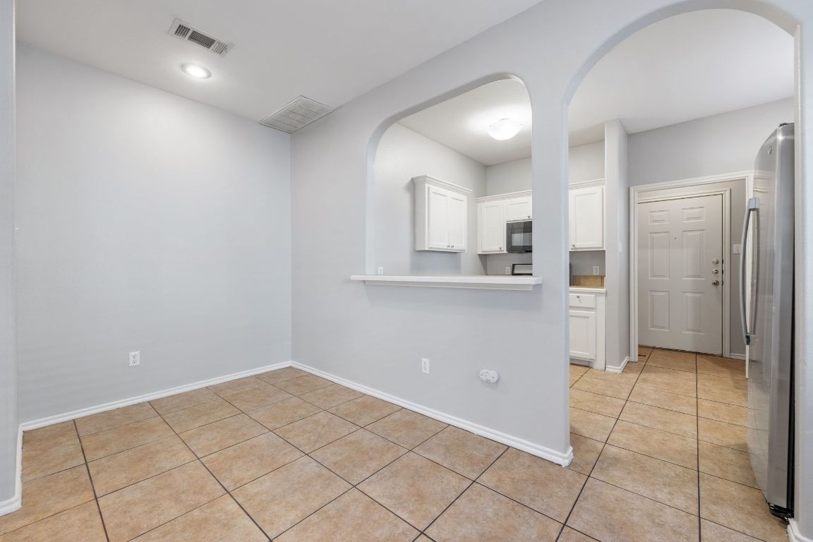 2906 Pearl Street, Unit C Austin, TX 78705 - Photo 7 of 28 a view of a kitchen with white cabinets