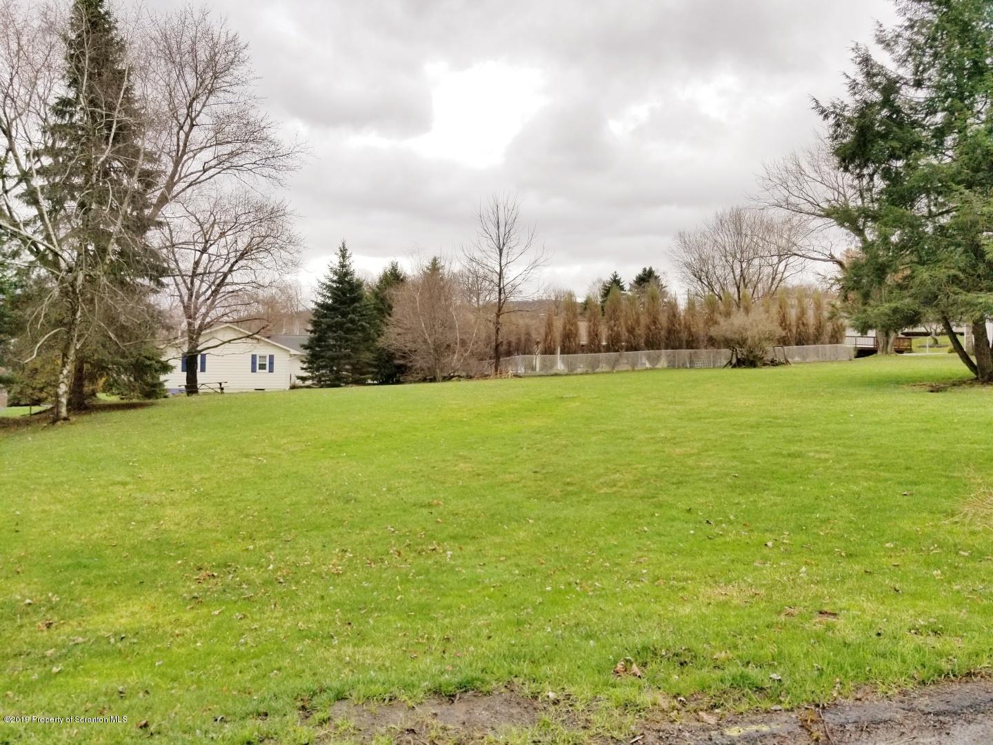 Primrose Drive Clarks Summit, PA 18411 - Photo 1 of 2 a view of a field with trees in the background
