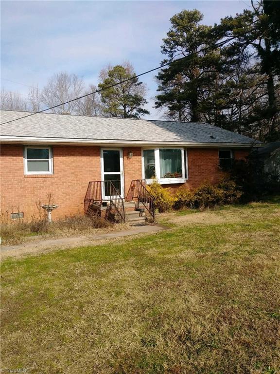 1409 Ritters Lake Road Greensboro, NC 27406 - Photo 2 of 14 Low maintenance brick siding.