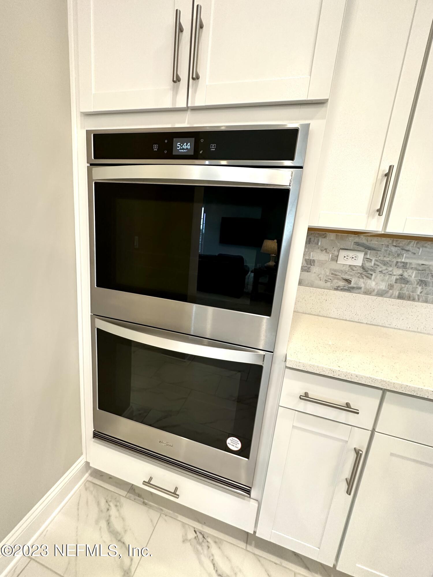 481 Marquesa Circle St. Johns, FL 32259 - Photo 11 of 53 a stove top oven sitting inside of a kitchen