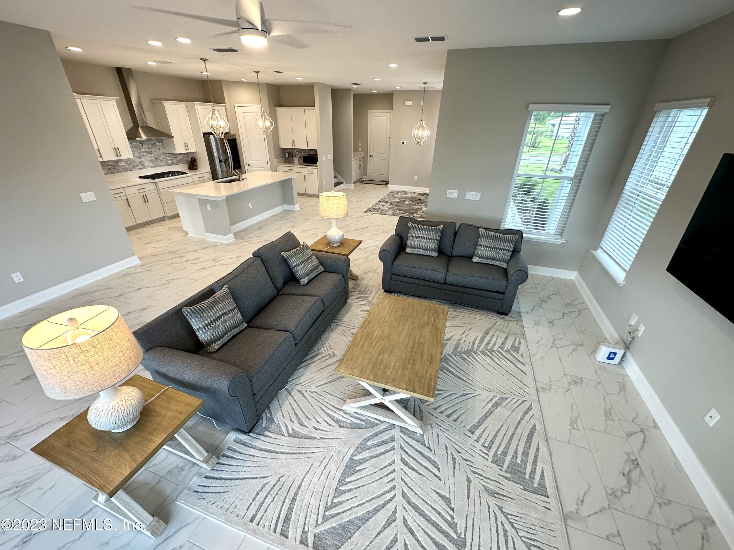 481 Marquesa Circle St. Johns, FL 32259 - Photo 18 of 53 a living room with furniture and a flat screen tv