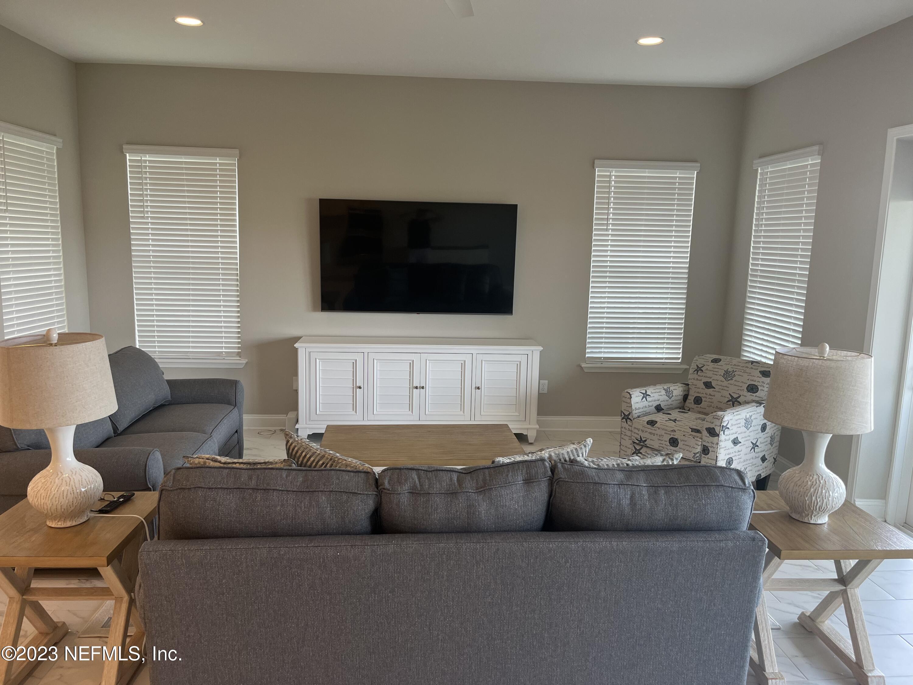 481 Marquesa Circle St. Johns, FL 32259 - Photo 19 of 53 a living room with furniture and a flat screen tv