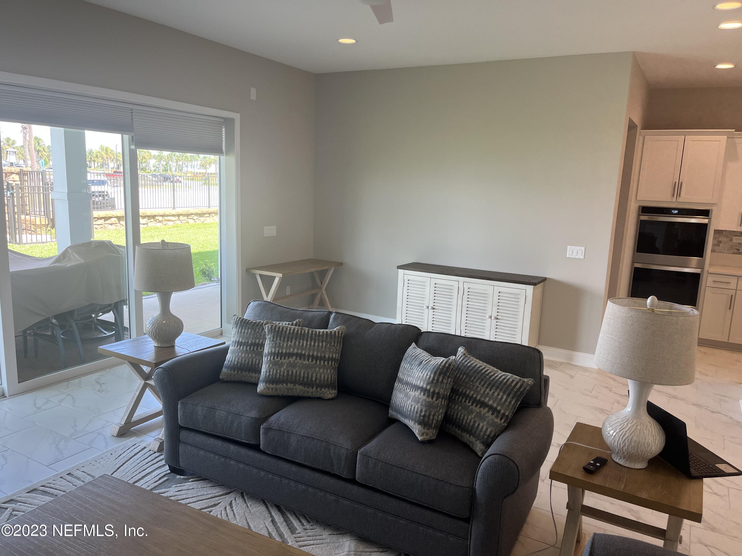 481 Marquesa Circle St. Johns, FL 32259 - Photo 20 of 53 a living room with furniture and a flat screen tv