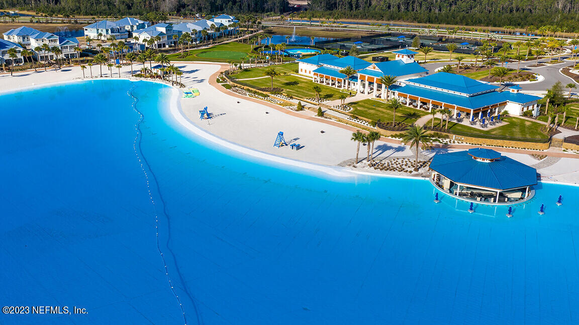 481 Marquesa Circle St. Johns, FL 32259 - Photo 2 of 53 a view of a swimming pool with lawn chairs and plants