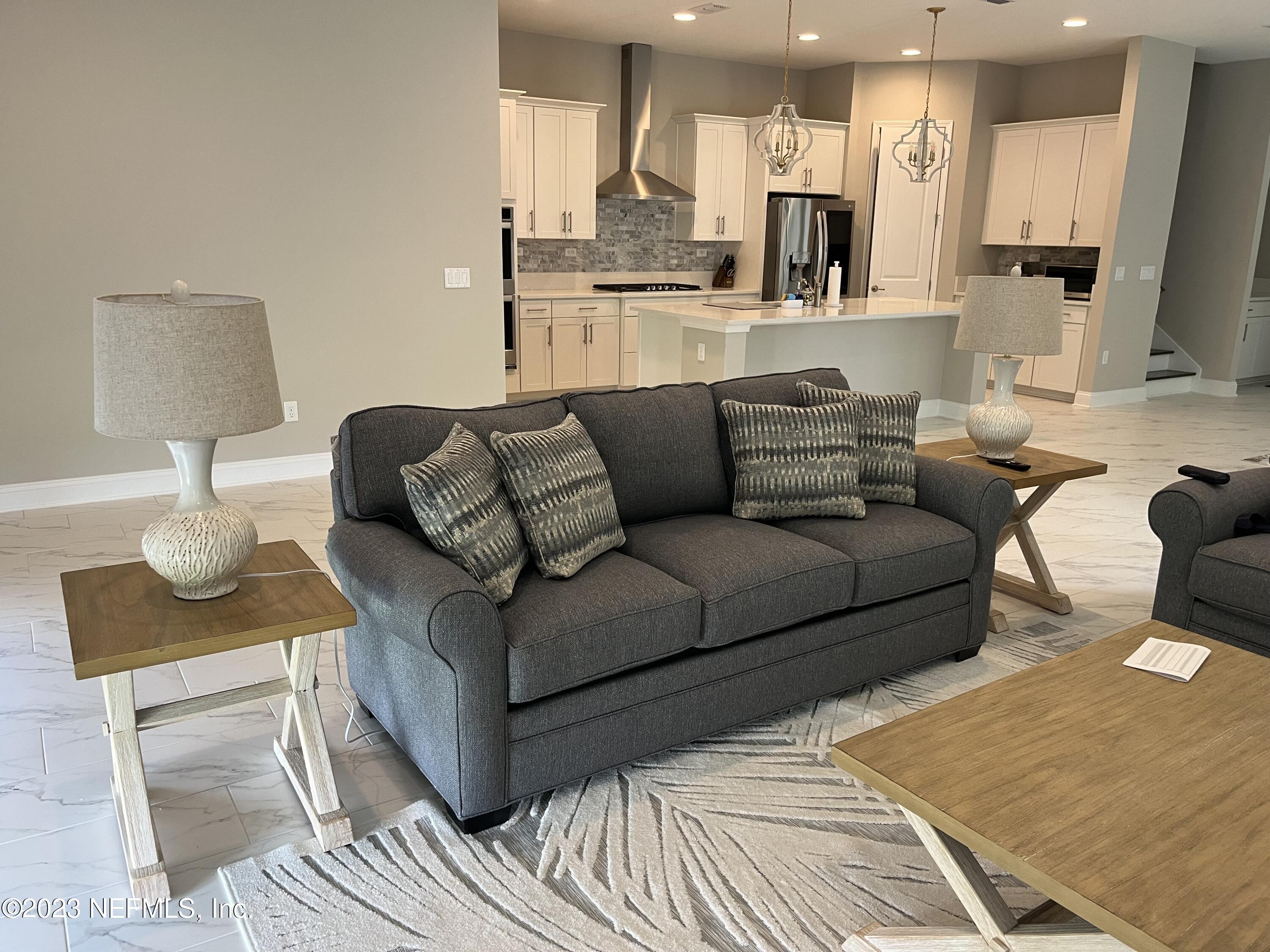 481 Marquesa Circle St. Johns, FL 32259 - Photo 21 of 53 a living room with furniture and a view of kitchen