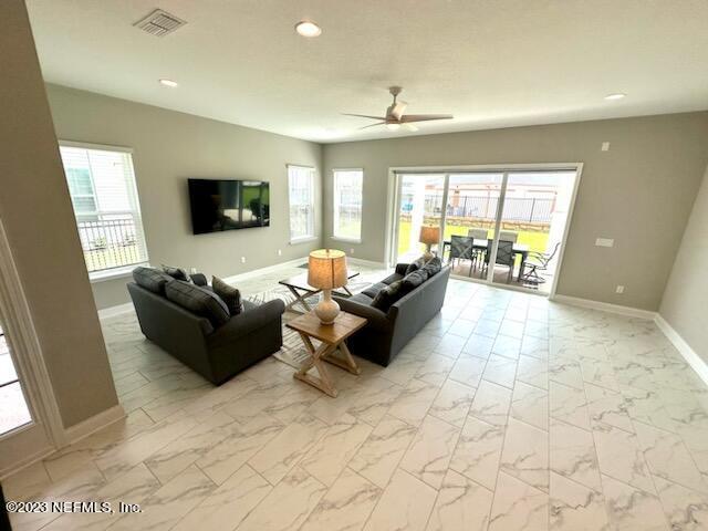 481 Marquesa Circle St. Johns, FL 32259 - Photo 23 of 53 a living room with furniture and a flat screen tv