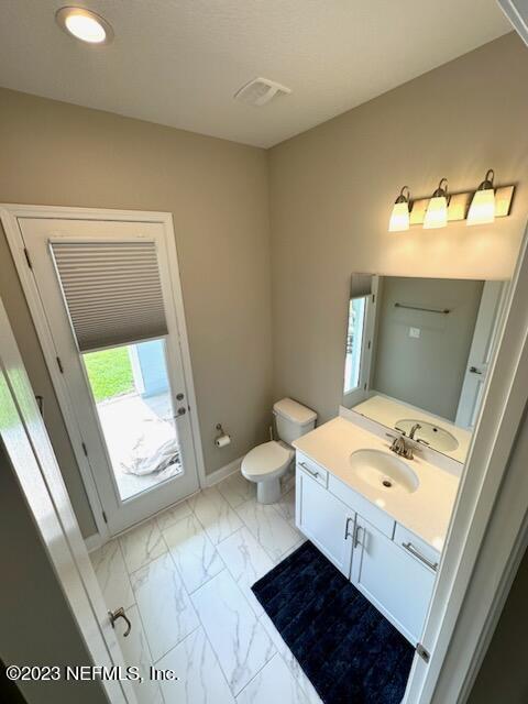 481 Marquesa Circle St. Johns, FL 32259 - Photo 25 of 53 a bathroom with a sink a toilet and a mirror