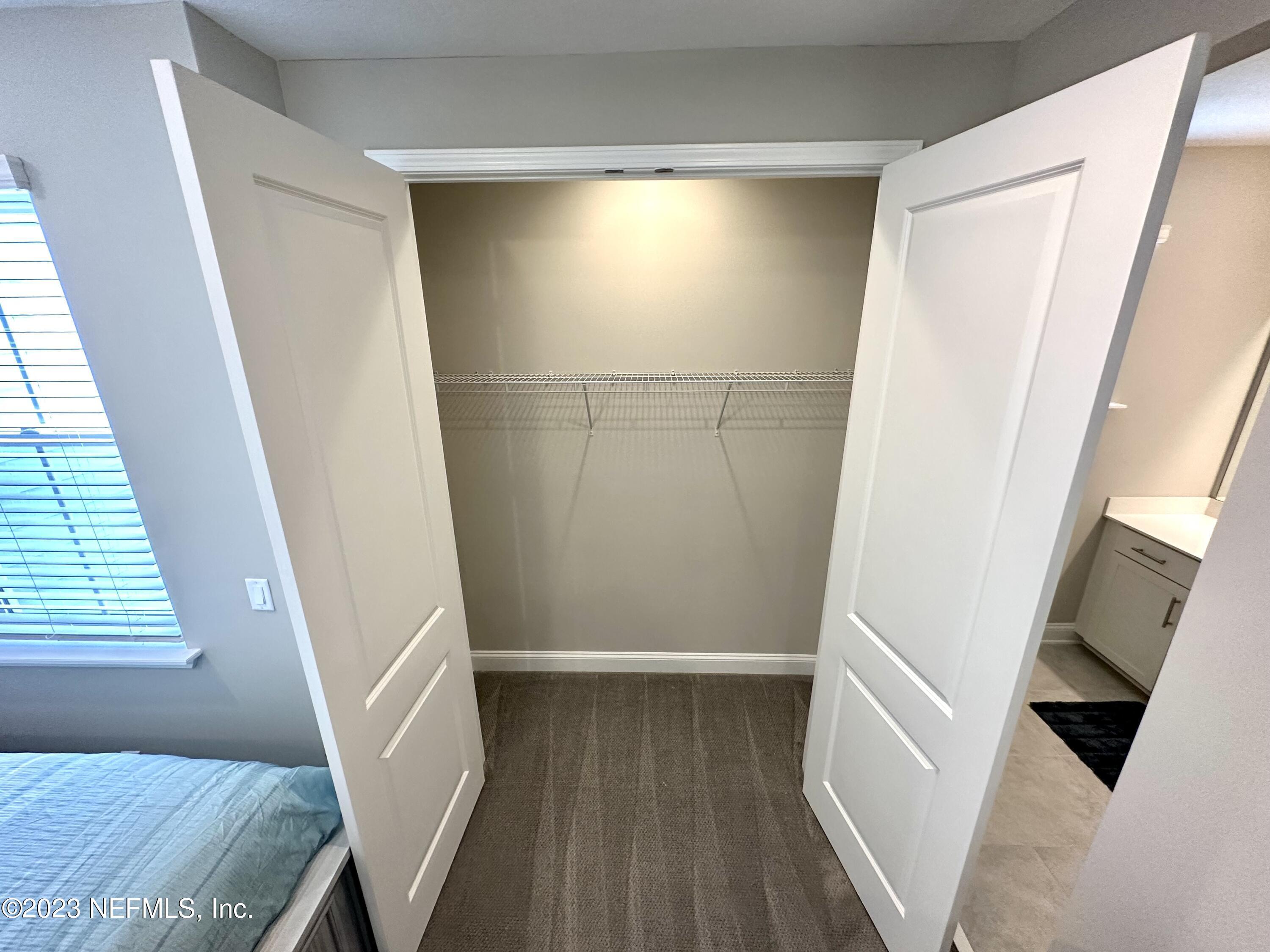 481 Marquesa Circle St. Johns, FL 32259 - Photo 28 of 53 a view of an empty room with wooden floor and a window