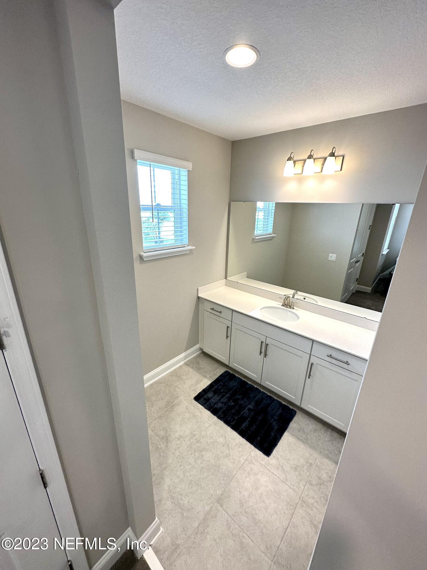 481 Marquesa Circle St. Johns, FL 32259 - Photo 29 of 53 a bathroom with a sink double vanity and a mirror