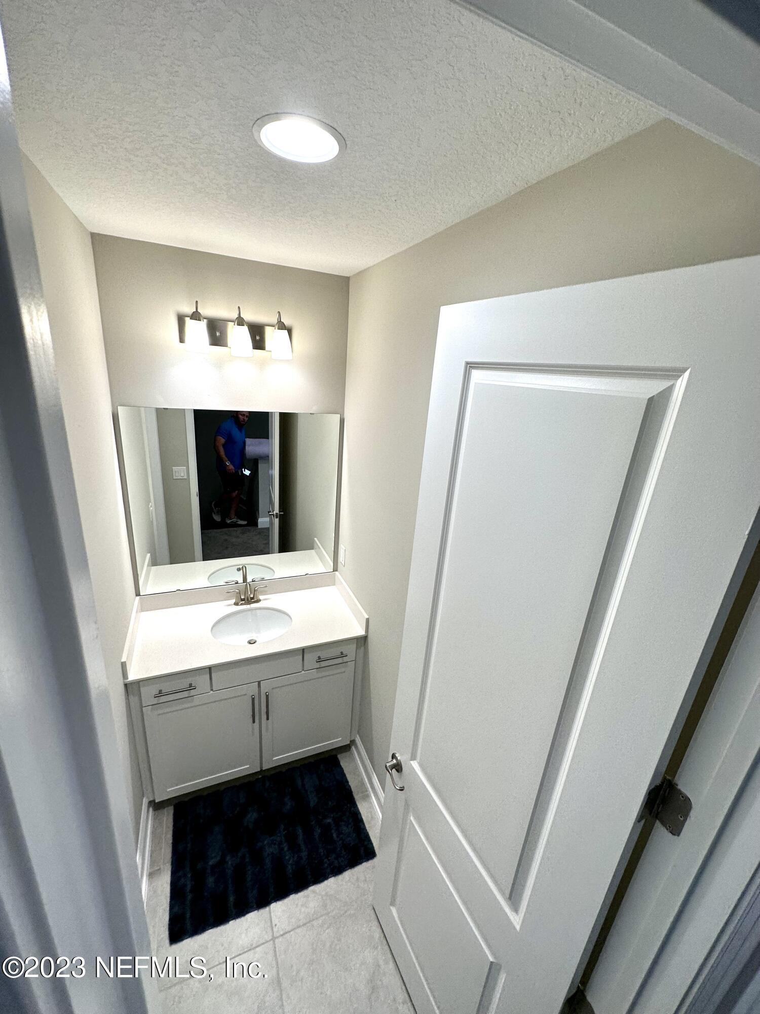 481 Marquesa Circle St. Johns, FL 32259 - Photo 35 of 53 a bathroom with a sink and a mirror