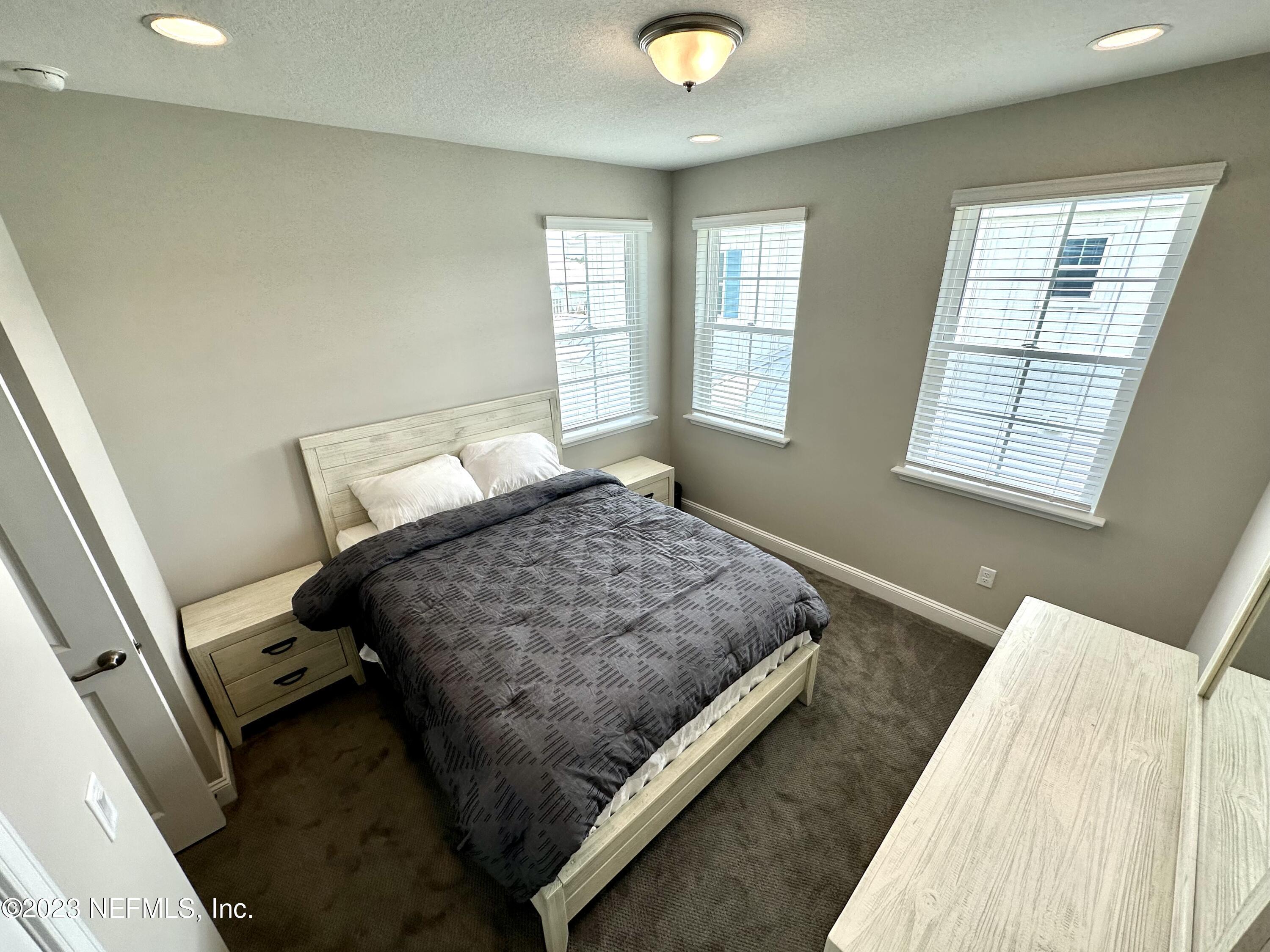 481 Marquesa Circle St. Johns, FL 32259 - Photo 36 of 53 a bedroom with a bed and window