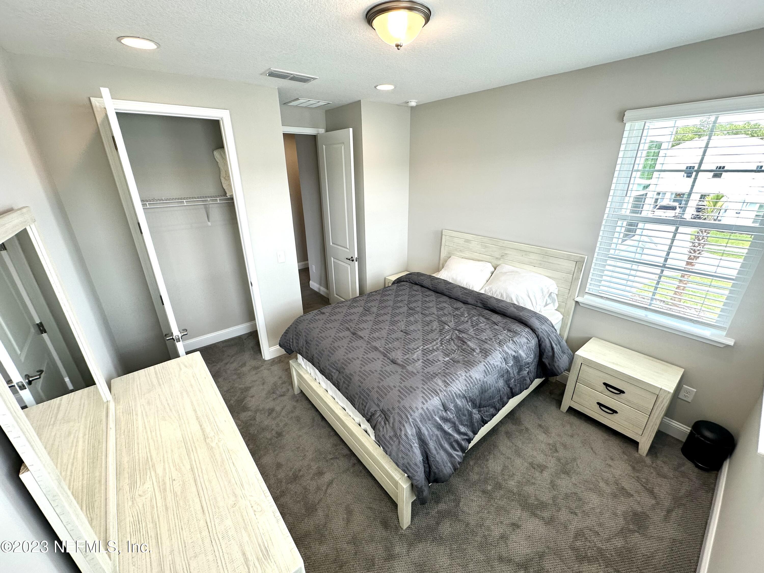 481 Marquesa Circle St. Johns, FL 32259 - Photo 37 of 53 a bedroom with a bed and wooden floor