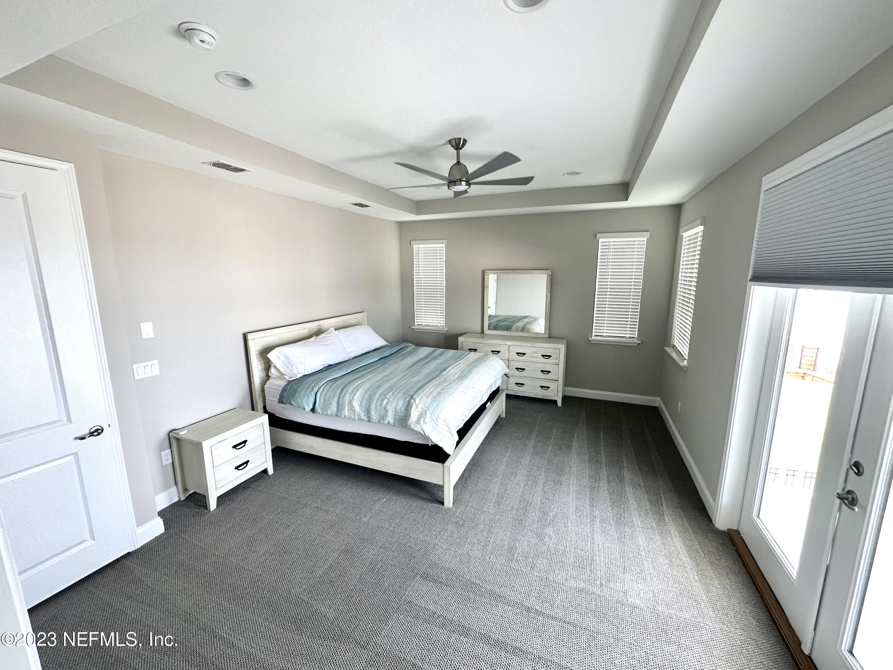 481 Marquesa Circle St. Johns, FL 32259 - Photo 43 of 53 a bedroom with a bed and a chandelier