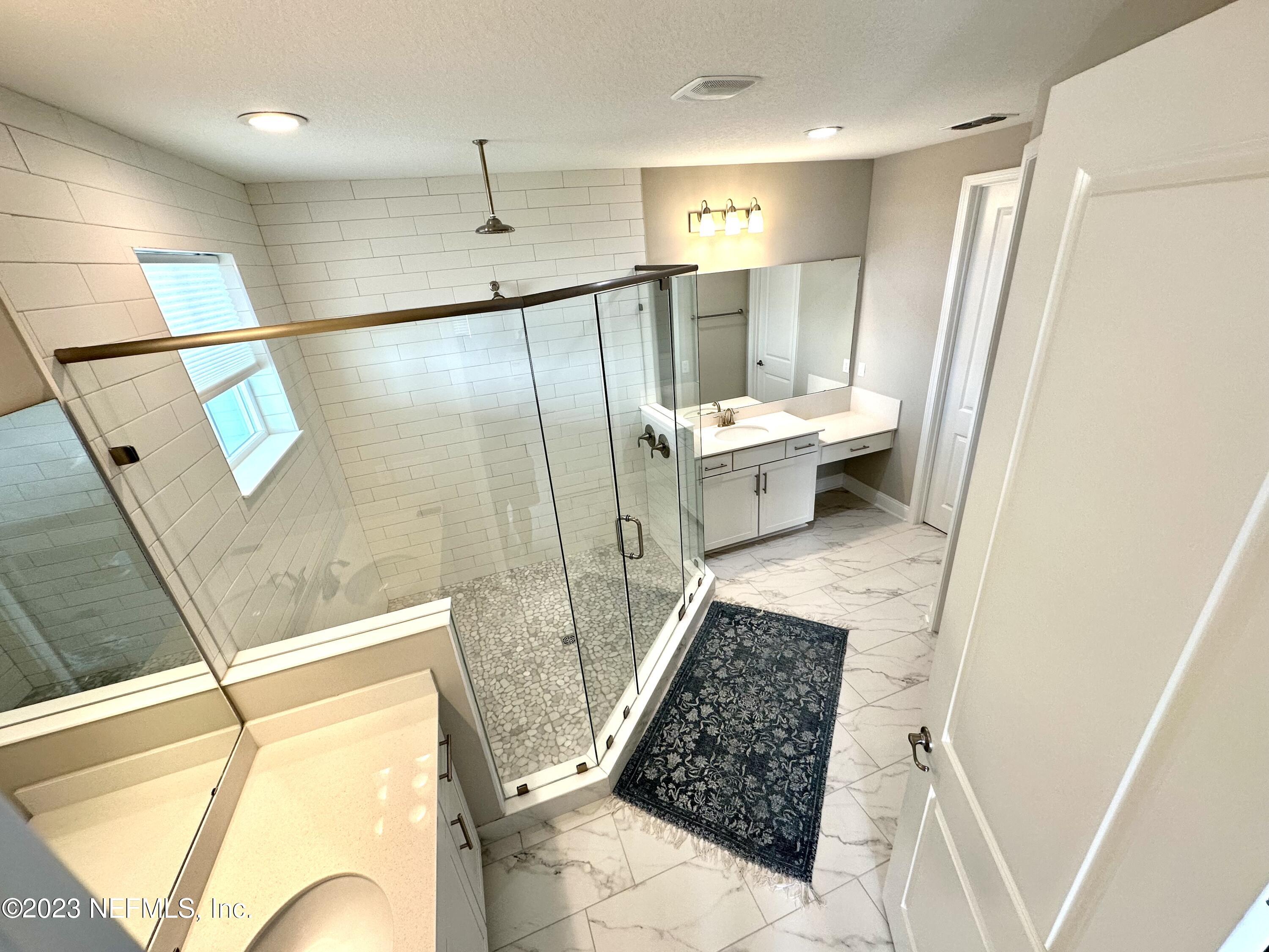 481 Marquesa Circle St. Johns, FL 32259 - Photo 46 of 53 a bathroom with a sink and a mirror