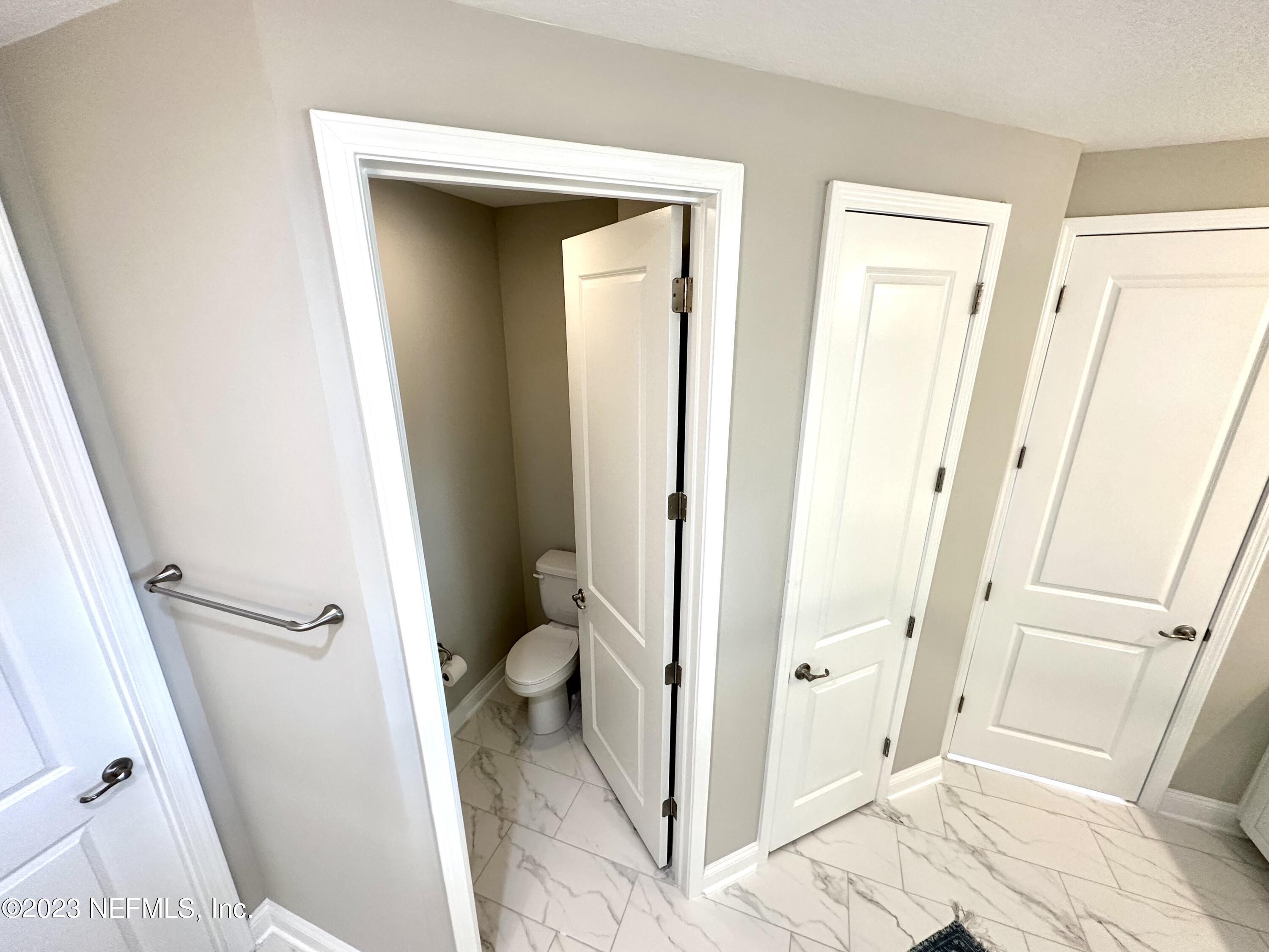 481 Marquesa Circle St. Johns, FL 32259 - Photo 47 of 53 a bathroom with a sink and a toilet