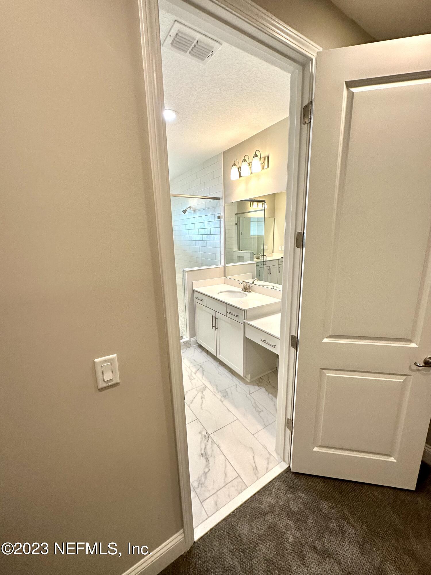 481 Marquesa Circle St. Johns, FL 32259 - Photo 49 of 53 a room with a wooden floor and white door