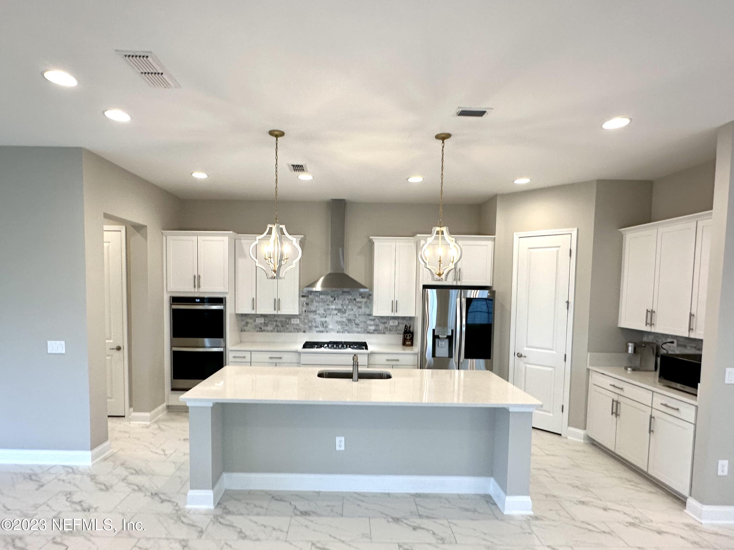481 Marquesa Circle St. Johns, FL 32259 - Photo 8 of 53 a view of kitchen with kitchen island a sink stainless steel appliances and cabinets