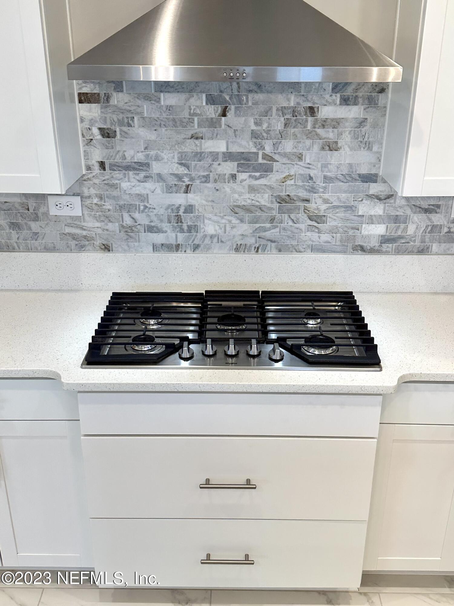 481 Marquesa Circle St. Johns, FL 32259 - Photo 10 of 53 a close view of a stove a microwave oven and stove