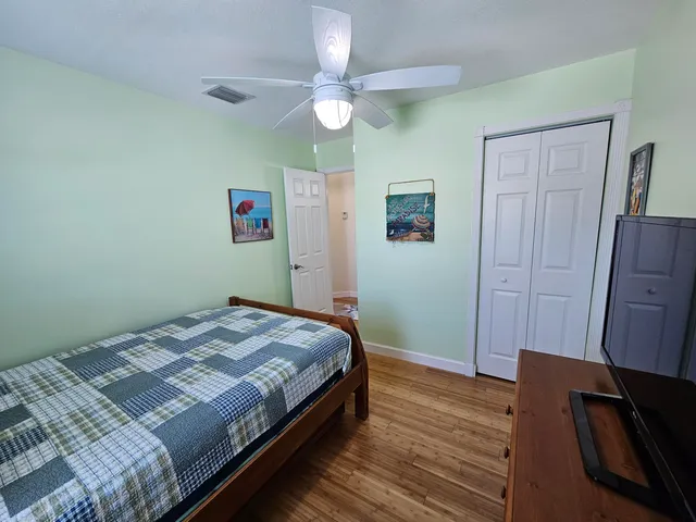 a bedroom with a bed and a dresser