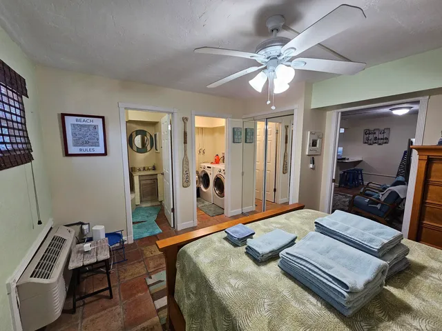 a bed room with a bed and a chandelier