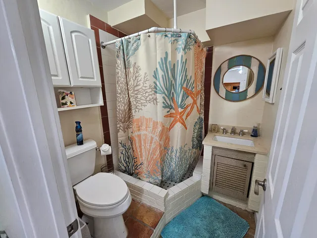 a bathroom with a toilet and a sink