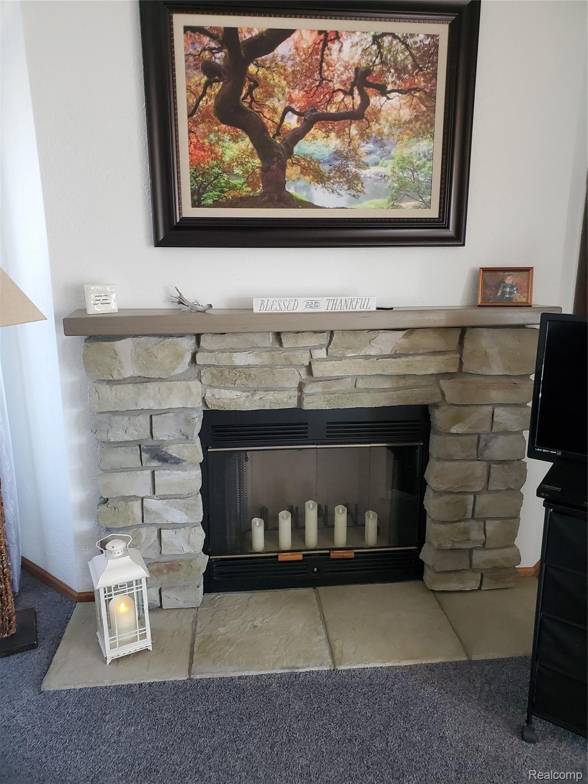 11595 West Sober Road Webberville, MI 48892 - Photo 20 of 42 11595 fireplace.jpg