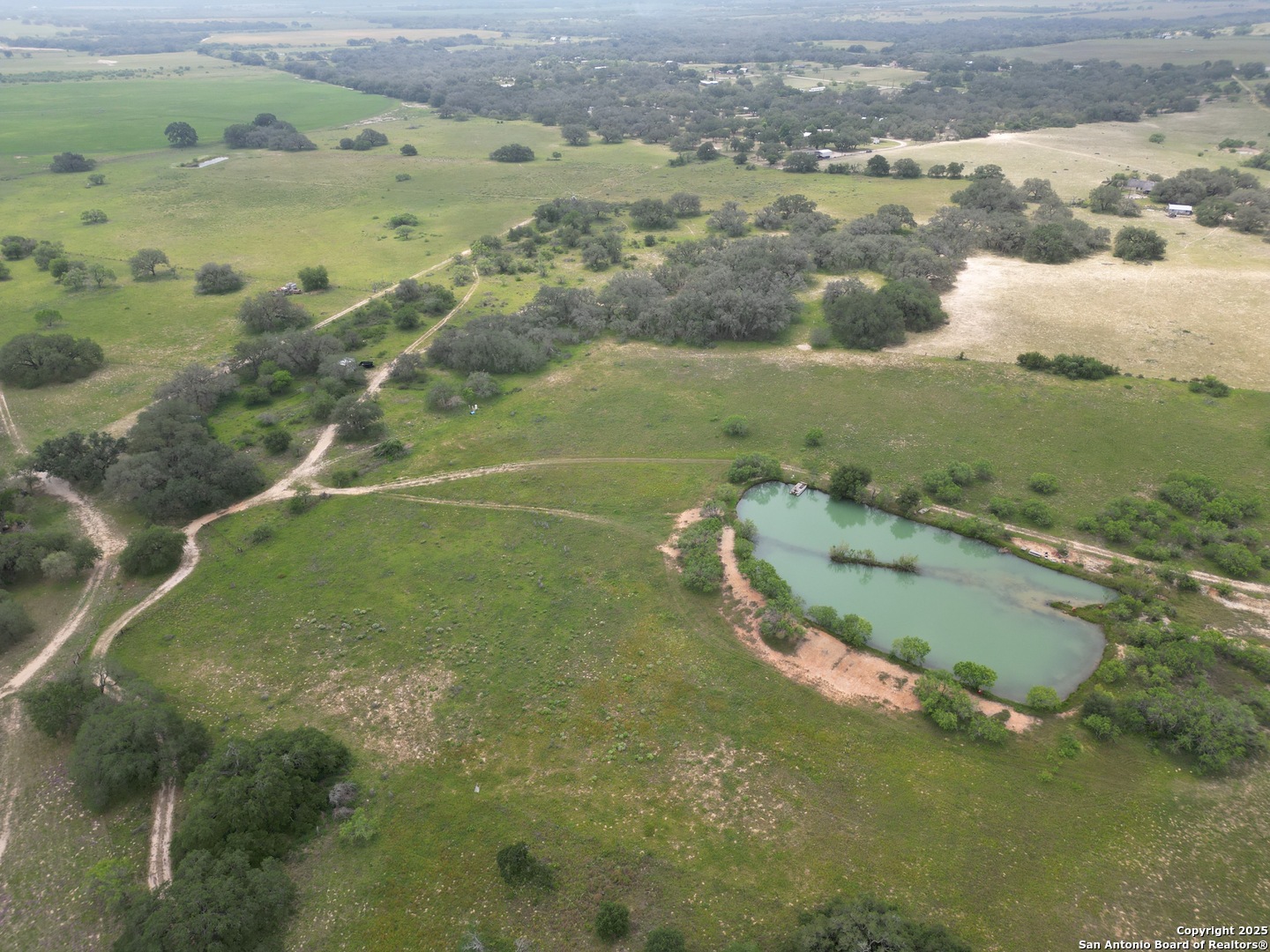 an aerial view of a houses with outdoor space