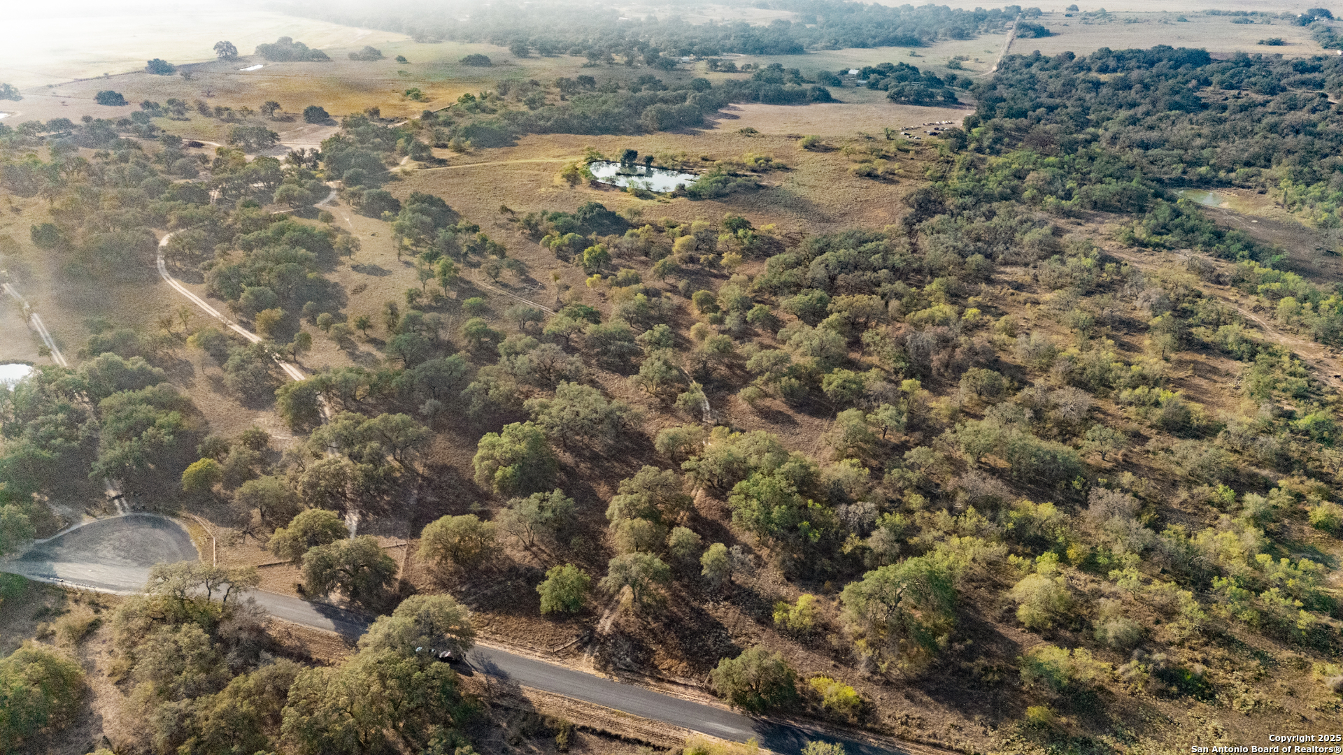 970 Newman Road Poteet, TX 78065 - Photo 22 of 30 an aerial view of house with yard