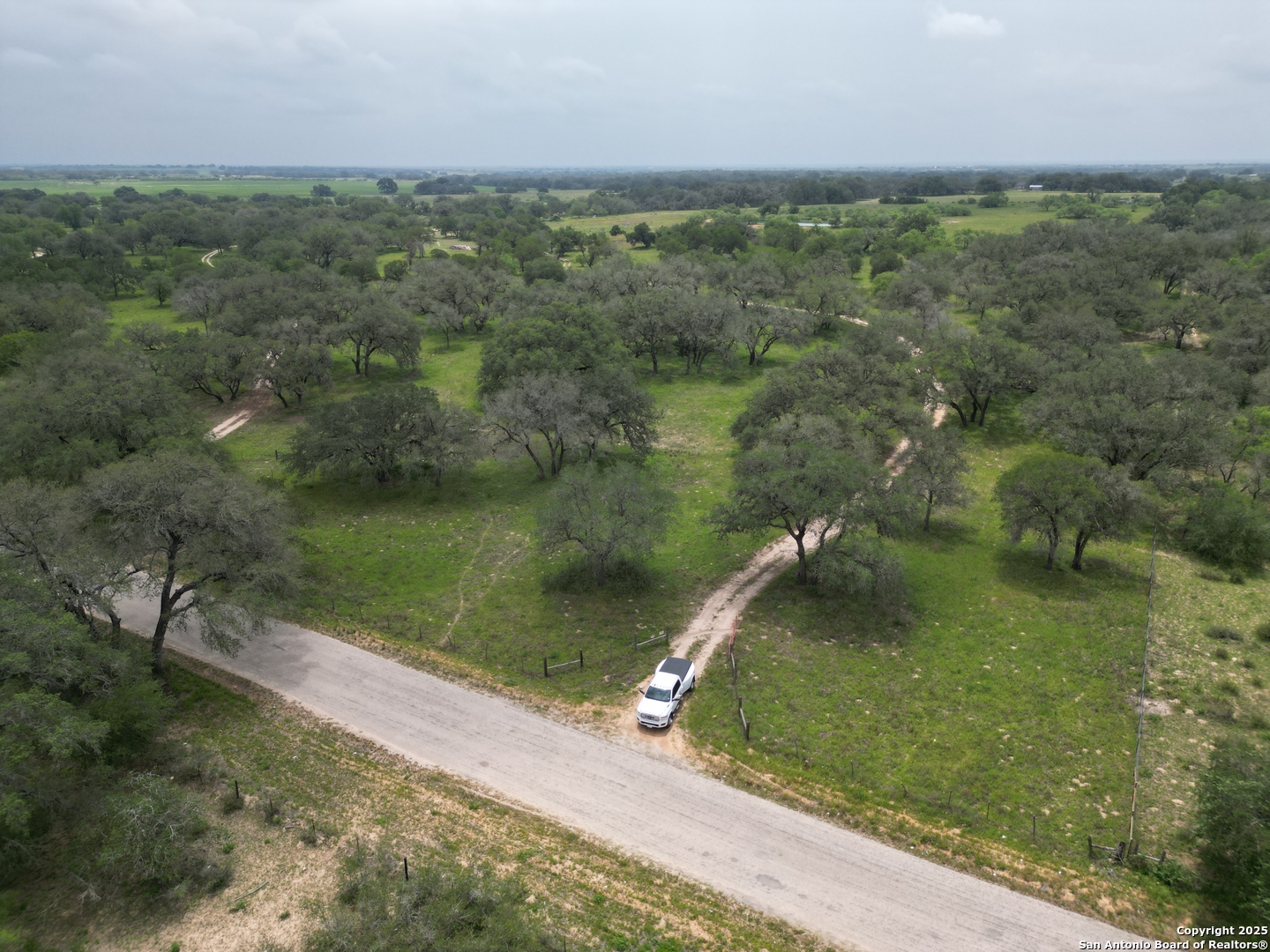 970 Newman Road Poteet, TX 78065 - Photo 5 of 30 an aerial view of a houses with a yard