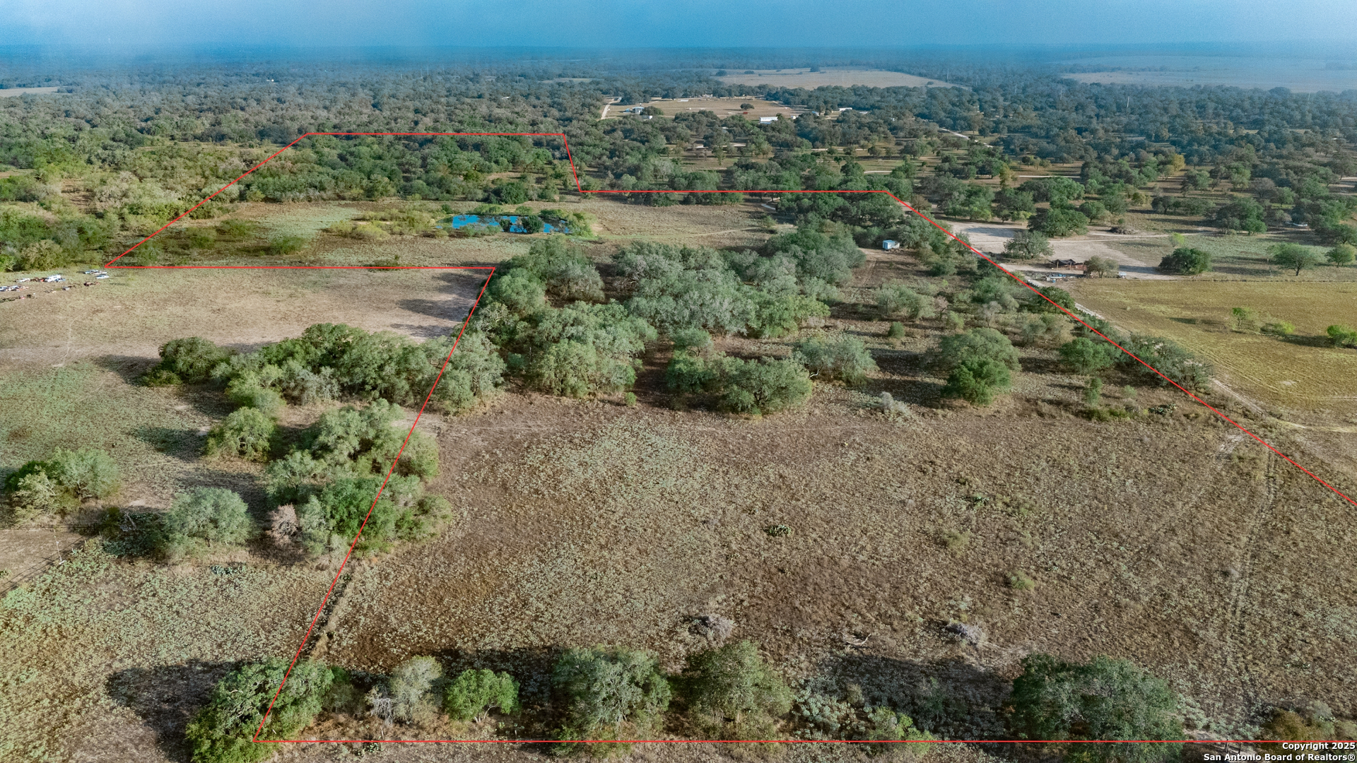 970 Newman Road Poteet, TX 78065 - Photo 8 of 30 an aerial view of mountains with green space