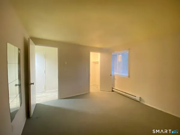 a view of an empty room and window