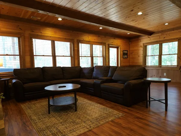 a view of a chair and fire pit in the backyard