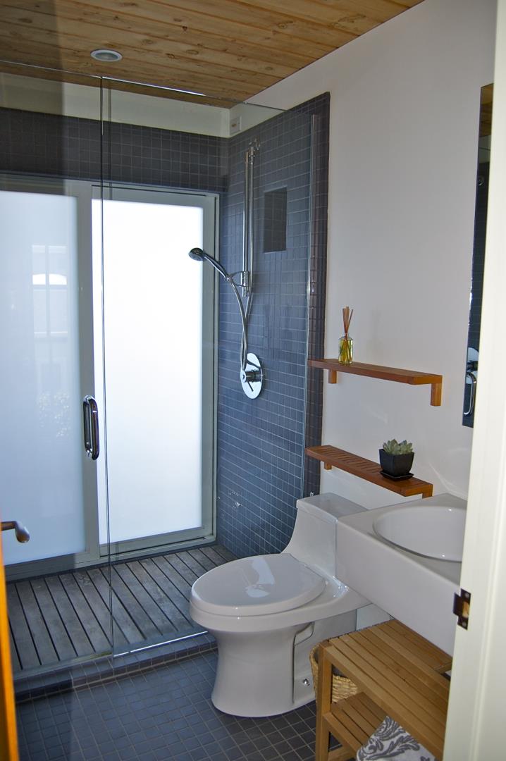 228 Kelly Avenue Half Moon Bay, CA 94019 - Photo 15 of 29 a bathroom with a sink a toilet and shower
