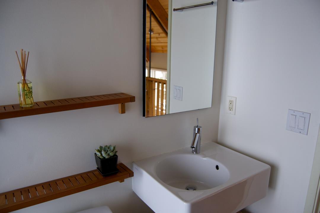 228 Kelly Avenue Half Moon Bay, CA 94019 - Photo 16 of 29 a bathroom with a sink and a window