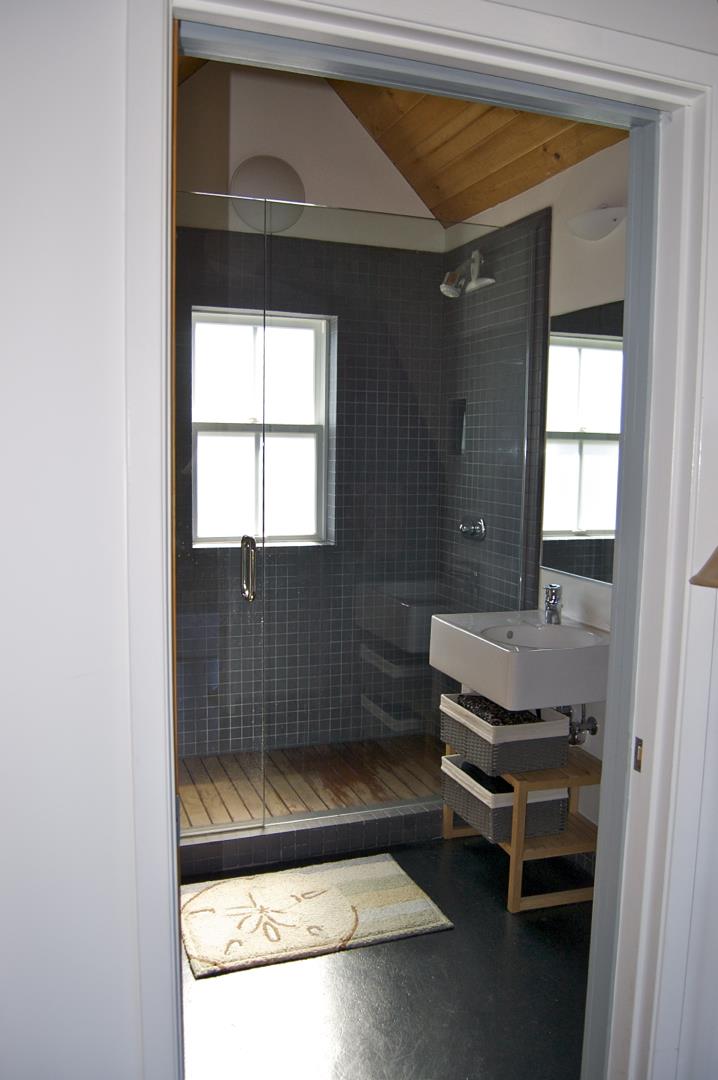 228 Kelly Avenue Half Moon Bay, CA 94019 - Photo 20 of 29 a bathroom with a sink and a mirror