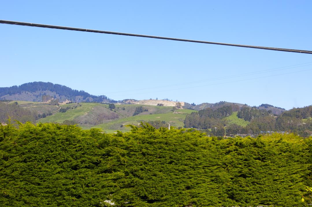 228 Kelly Avenue Half Moon Bay, CA 94019 - Photo 27 of 29 a view of a city with a mountain