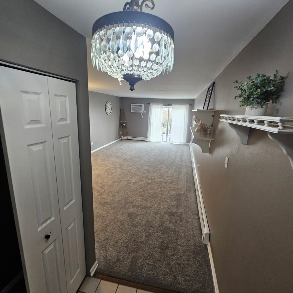 1133 South Finley Road, Unit 404 Lombard, IL 60148 - Photo 2 of 18 a view of a livingroom with window