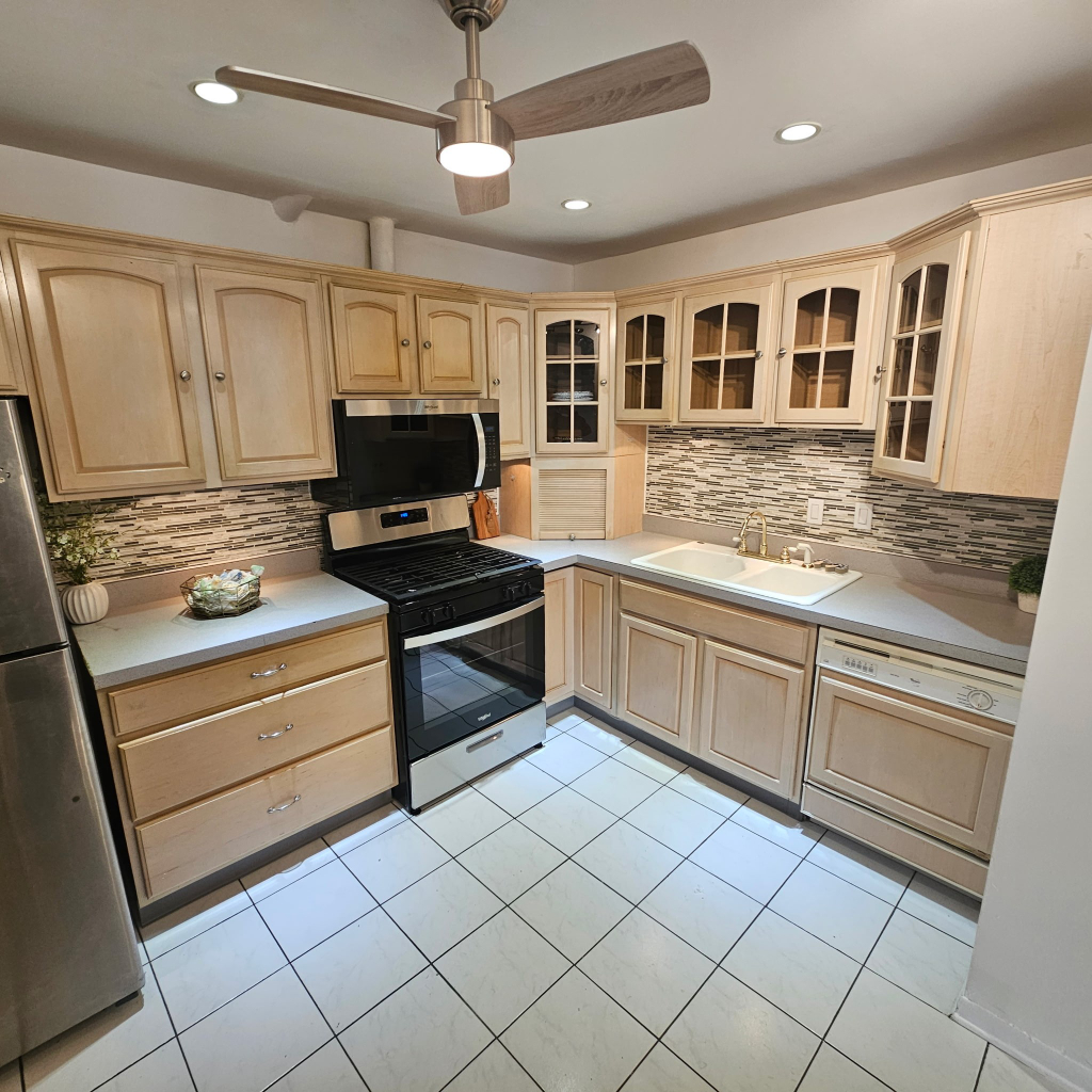 1133 South Finley Road, Unit 404 Lombard, IL 60148 - Photo 5 of 18 a kitchen with stainless steel appliances granite countertop a stove and a sink
