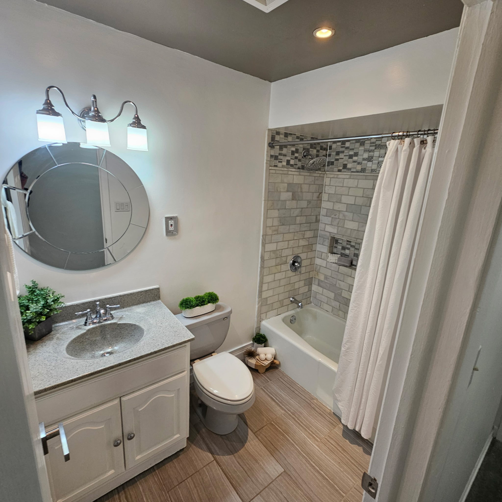 1133 South Finley Road, Unit 404 Lombard, IL 60148 - Photo 8 of 18 a bathroom with a granite countertop sink toilet and shower