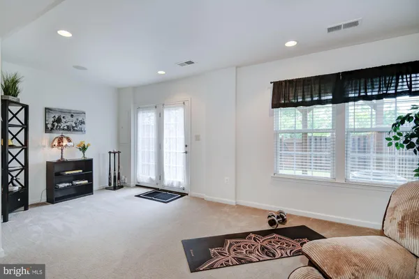 a livingroom with furniture and window