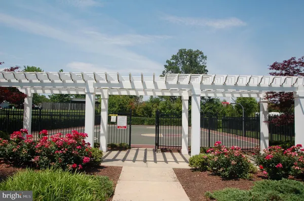 a view of a house with a porch and garden