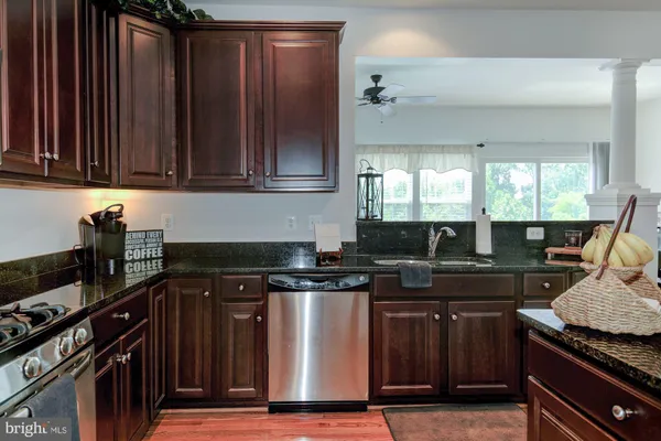 a kitchen with a stove and a sink