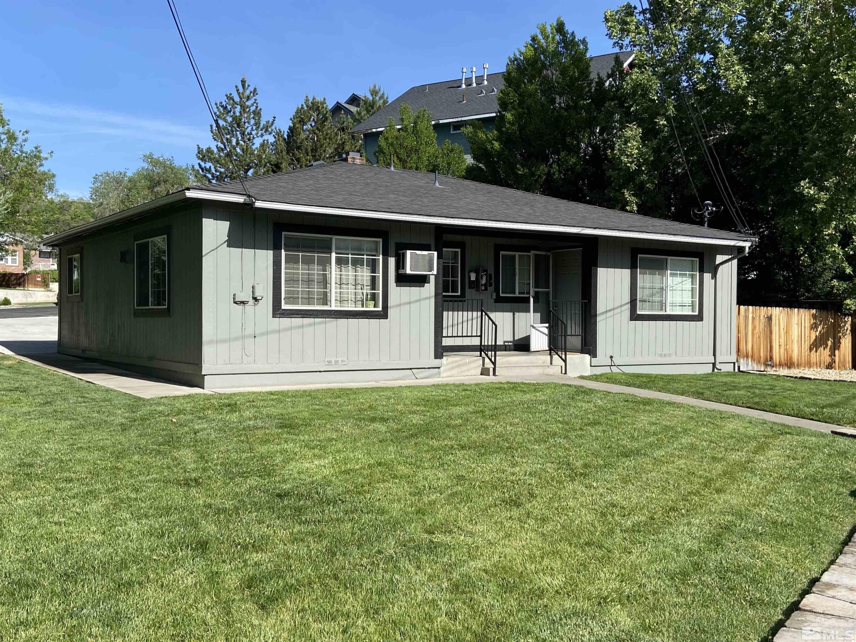 1101 North Sierra Street Reno, NV 89503 - Photo 1 of 10 a front view of a house with a yard