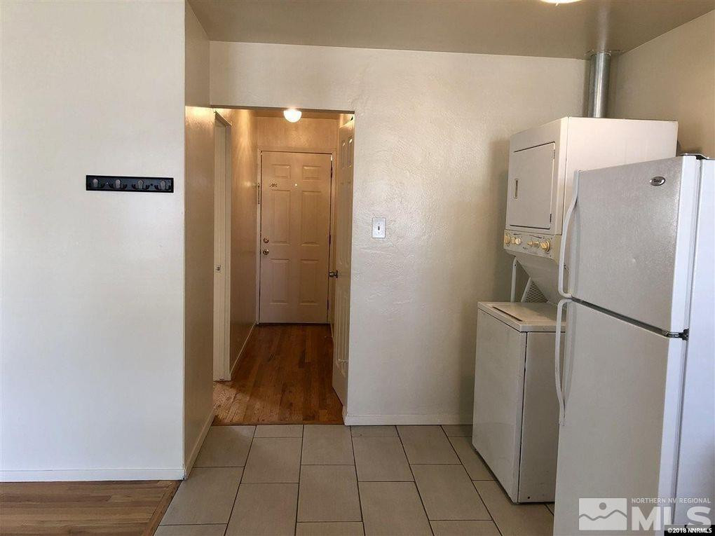 1101 North Sierra Street Reno, NV 89503 - Photo 7 of 10 a view of a refrigerator in kitchen and an empty room