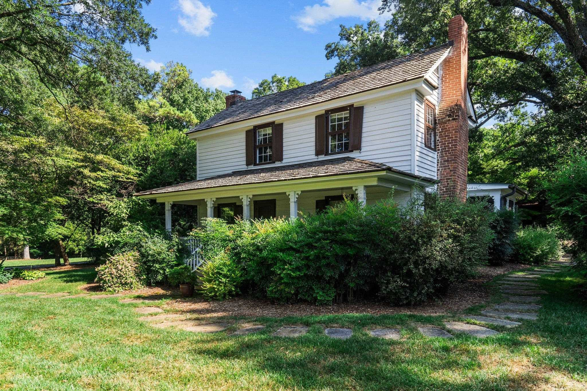 4900 West Cornwallis Road Durham, NC 27705 - Photo 11 of 100 a front view of a house with a yard