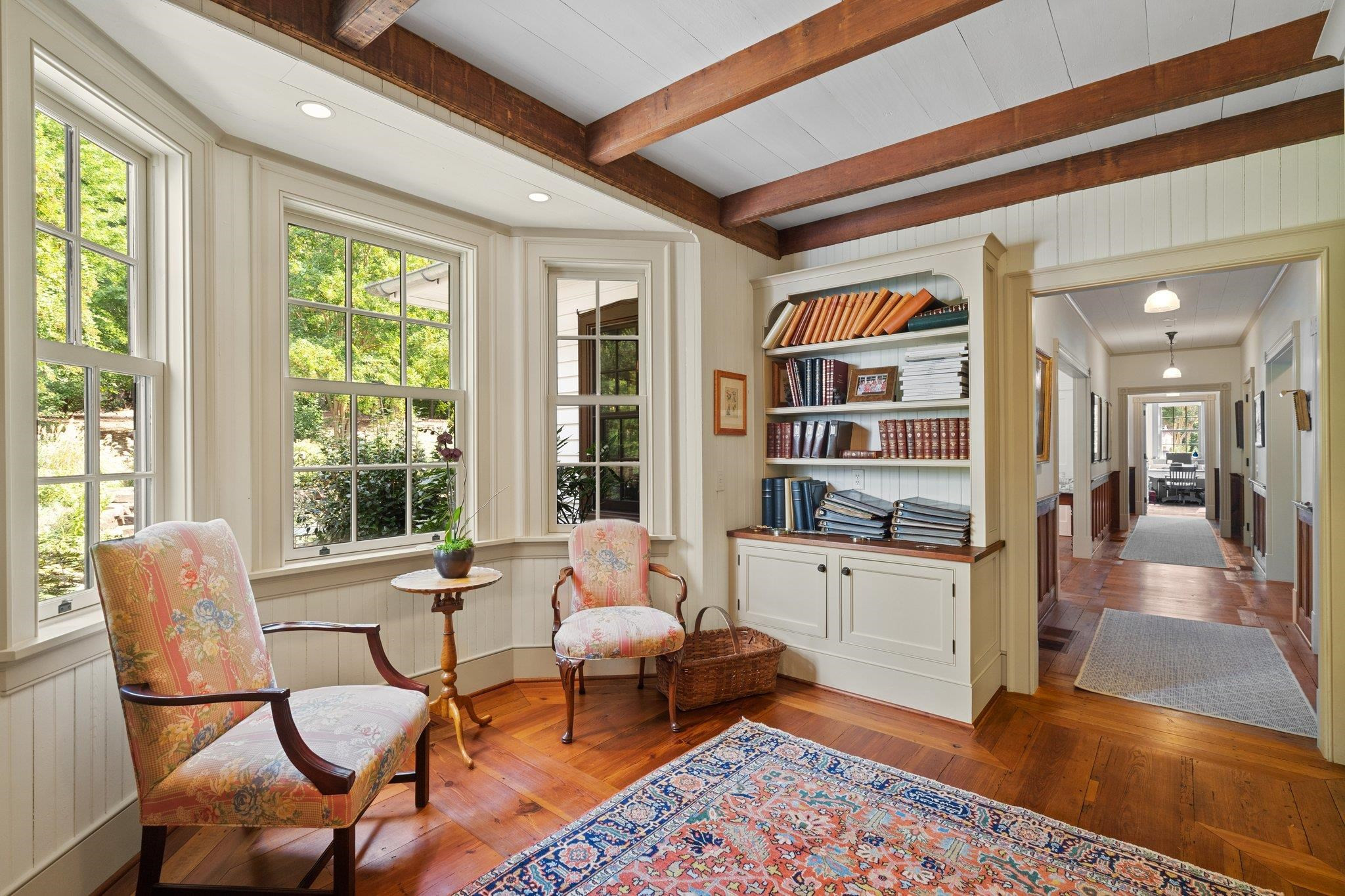 4900 West Cornwallis Road Durham, NC 27705 - Photo 25 of 100 a living room with furniture two window and wooden floor