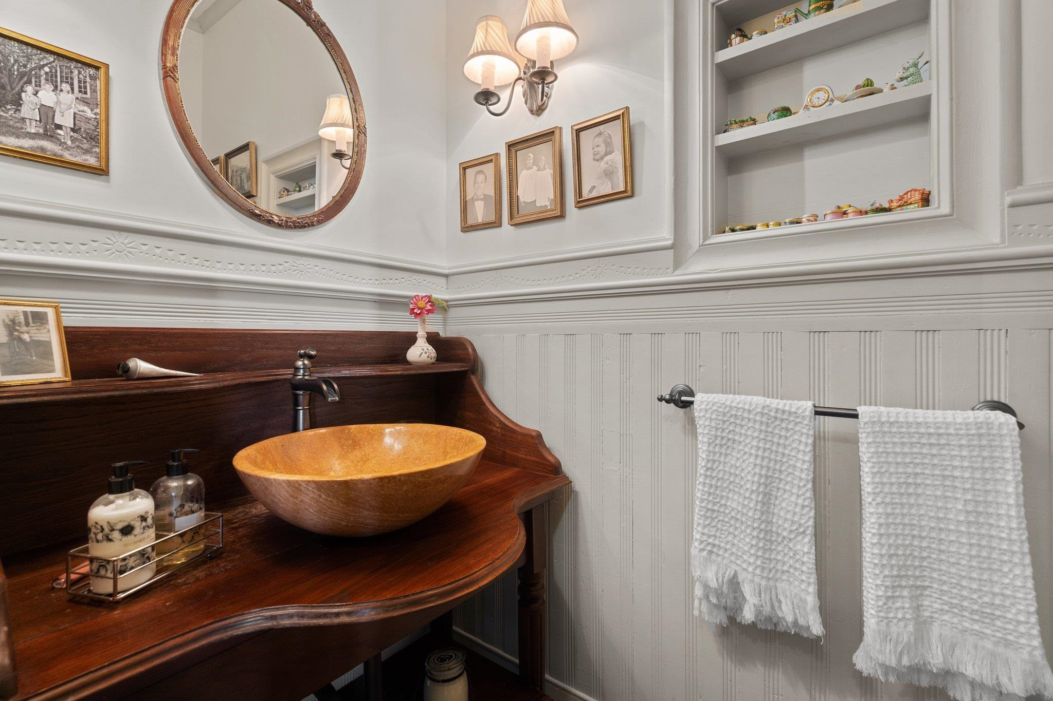 4900 West Cornwallis Road Durham, NC 27705 - Photo 26 of 100 a bathroom with a sink and a mirror