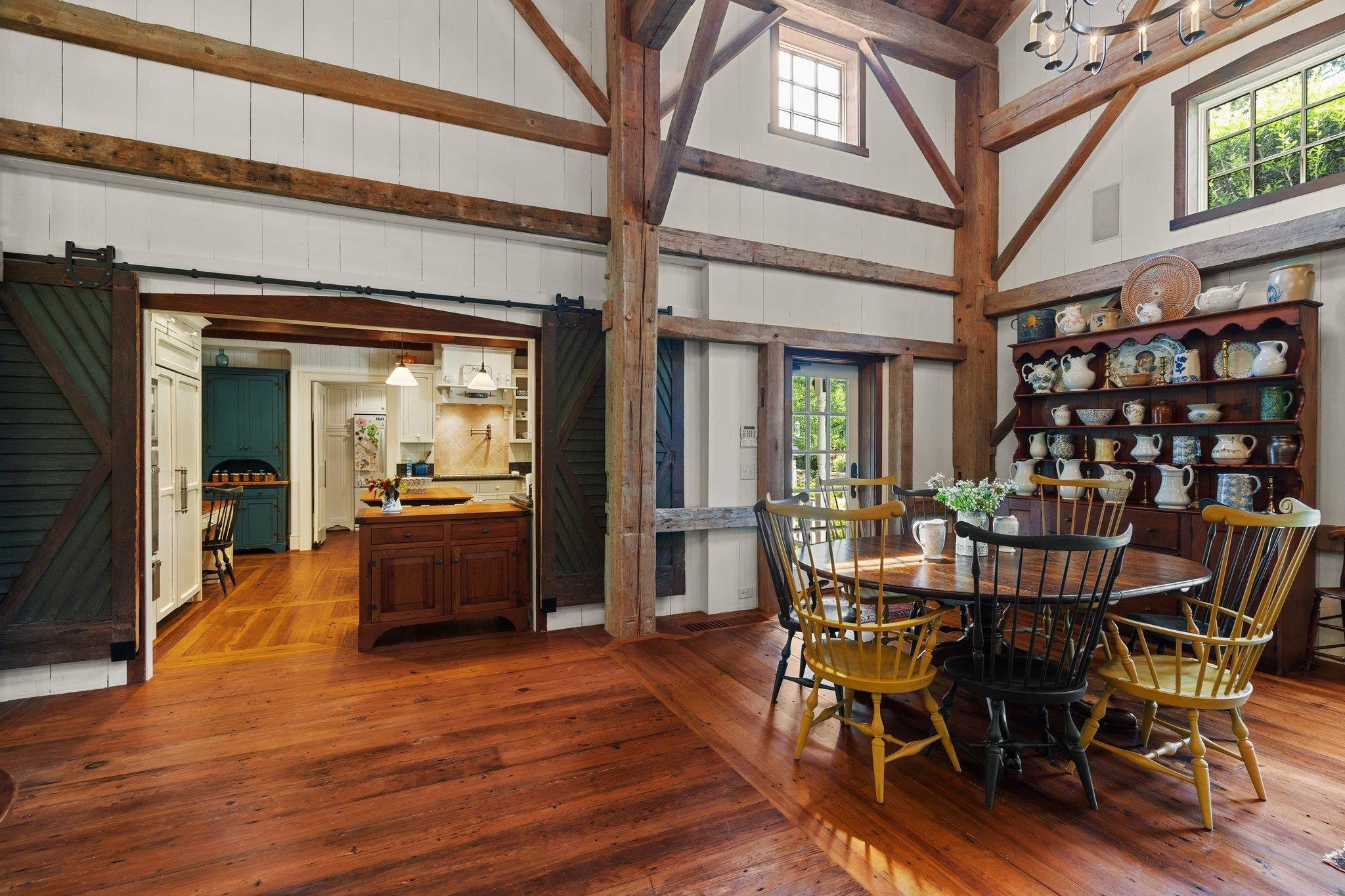 4900 West Cornwallis Road Durham, NC 27705 - Photo 35 of 100 a view of a dining room with furniture and wooden floor