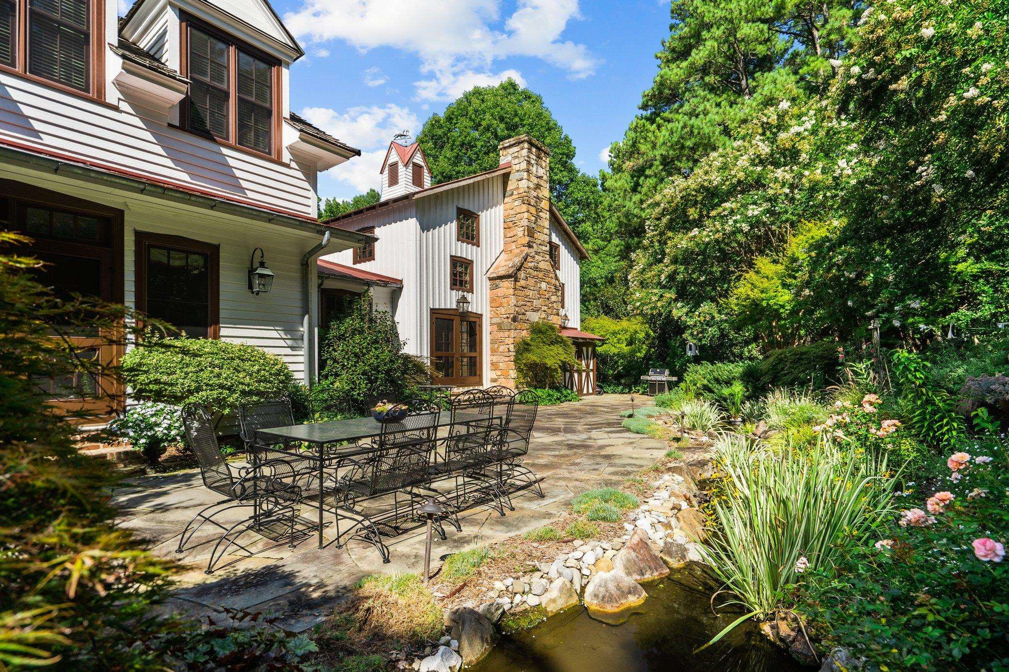 4900 West Cornwallis Road Durham, NC 27705 - Photo 43 of 100 a view of a house with a yard