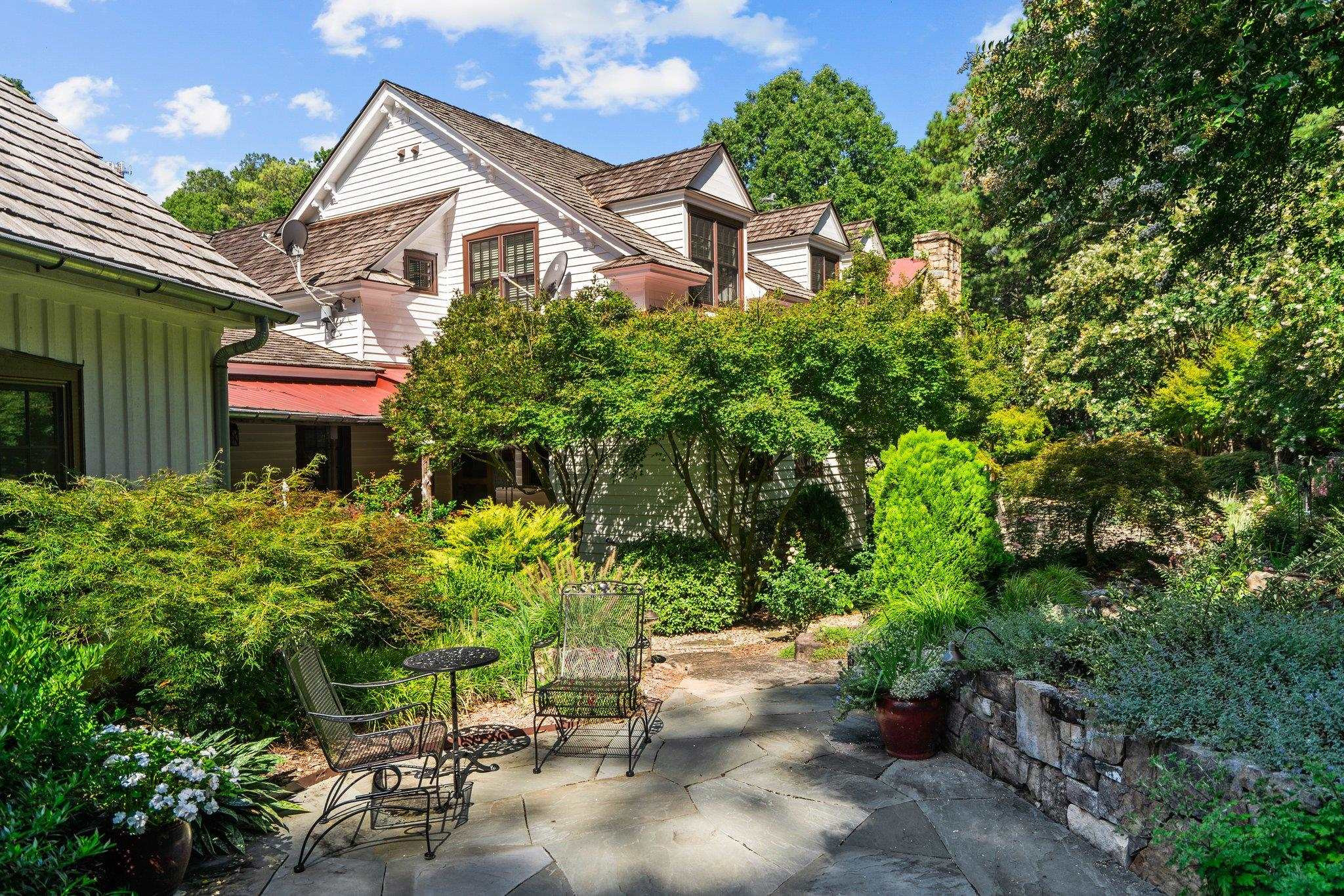 4900 West Cornwallis Road Durham, NC 27705 - Photo 48 of 100 a front view of a house with a yard